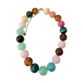 Multicolored beaded necklace on a white background