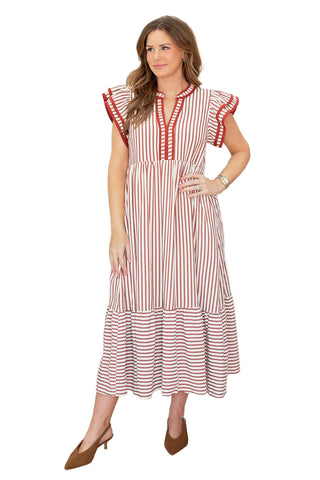 Entro Aurora dress in rust and cream stripes featuring flutter sleeves, V-neckline and tiered midi length with mixed stripe patterns