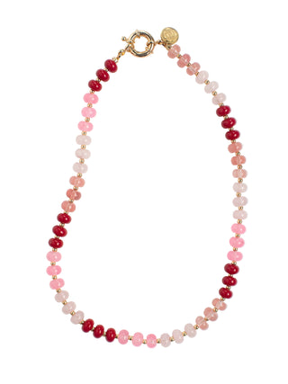 Beaded necklace with pink and red beads on a white background