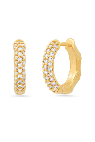 Tai Jewelry Bamboo ave Reversible Huggies. Gold huggie hoop earrings showing both sides - one with pavé crystal setting and one with smooth bamboo texture design, demonstrating reversible feature
