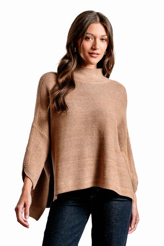 Kerisma Boho Sweater in Camel. Camel colored mock neck sweater with asymmetrical hem and relaxed fit 
