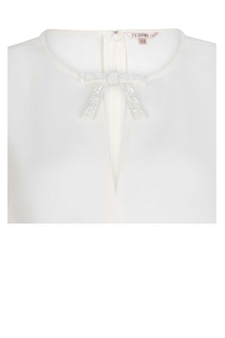 White blouse with a decorative bow on a white background