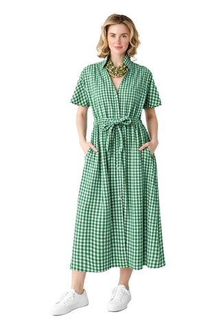 Woman wearing a green checkered dress with self-tie waist tie