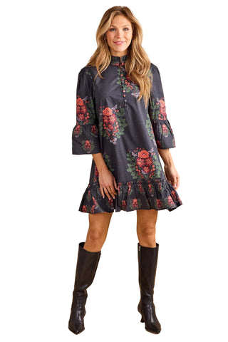 Double A Chelsea Dress in Terrace. Charcoal gray dress with coral and green floral print, high neck, bell sleeves, and ruffled hem