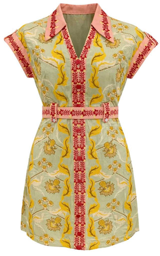 Embroidered dress with yellow and red patterns on a light background