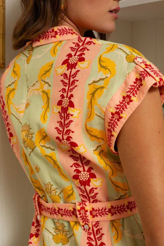 Colorful floral patterned shirt with a belt worn by a person.