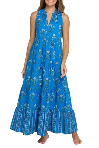 Woman wearing a blue floral dress on a white background