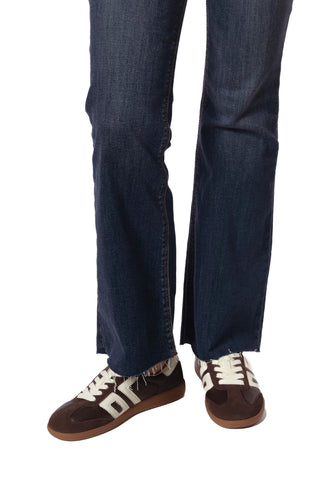 Dark blue jeans worn by a person on a white background. Back70 Cloud Sneakers - Coffee Milk