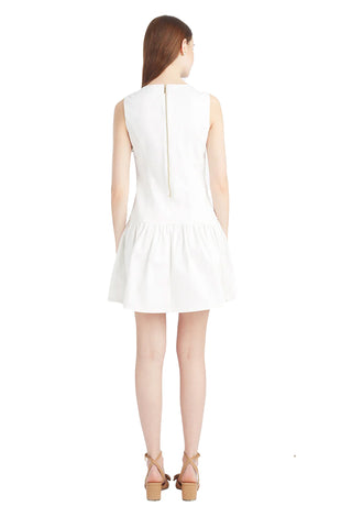 Draper James Colette white denim flounce dress with square neckline and A-line skirt on model