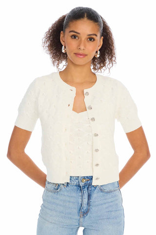 Allison New York Effie Cardigan in White. White short sleeve cardigan with round neckline, silver flower buttons down front, and slim fitted silhouette