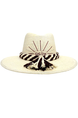 Baldiz Gig Em Game Day Hat. Natural straw hat with embroidered 'GIG EM' sunburst design and twisted maroon and cream rope band with tassels
