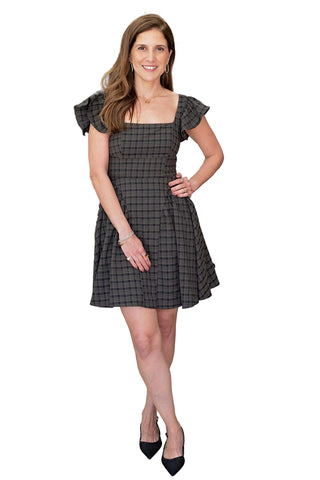 Moon River Gigi Plaid Ruffle Sleeve Corset Mini Dress. dark brown plaid mini dress with ruffle cap sleeves, square neckline, and corset lace-up back detail
