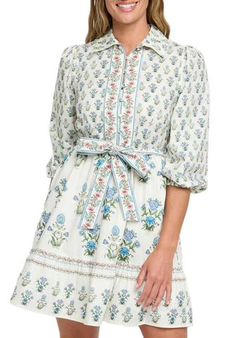 Woman wearing a floral dress with a white background