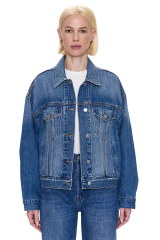 Pistola Harley Relaxed Trucker Jacket in Roulette. Classic medium blue denim trucker jacket with relaxed fit, traditional button front closure, chest pockets, and vintage-inspired wash