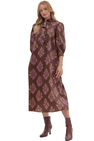 Chocolate brown midi dress with purple and gold ornate floral print, high neck tie detail, and three-quarter sleeves 
