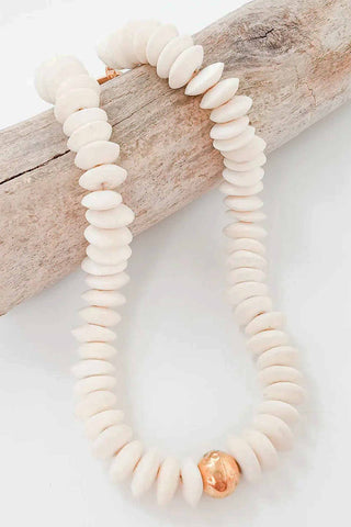 Cream colored heishi bone disc bead necklace with single rose gold accent bead
