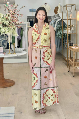 Woman wearing a patterned dress in a store setting
