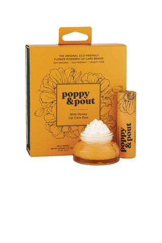 Poppy & Pout wild honey lip care gift set with golden-orange packaging featuring floral design, includes lip balm and scrub