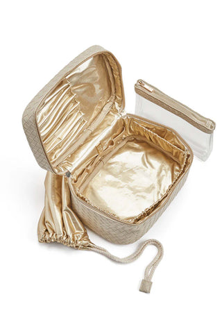 Bisque woven vegan leather train case with gold zipper, top handle, and structured rectangular shape for beauty product storage