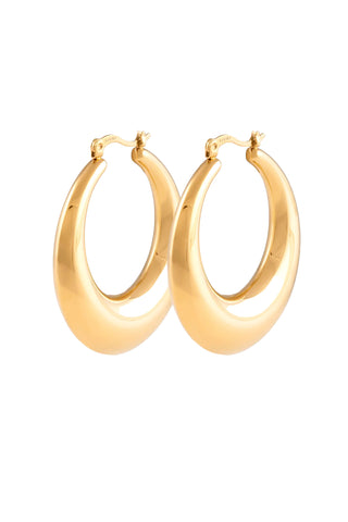 Pair of chunky gold oval hoop earrings with smooth polished finish and secure hinge closure