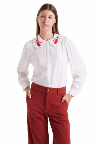 Compania Fantastica Meg top in white cotton featuring Peter Pan collar with colorful pink and red embroidered details, puff sleeves and button-front closure