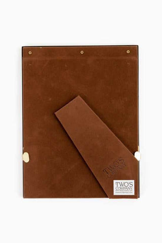 Brown leather notebook with a strap closure on a white background