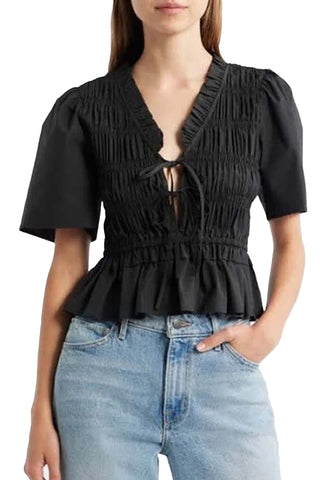 black short sleeve top with smocked bodice, tie front closure, and peplum hem