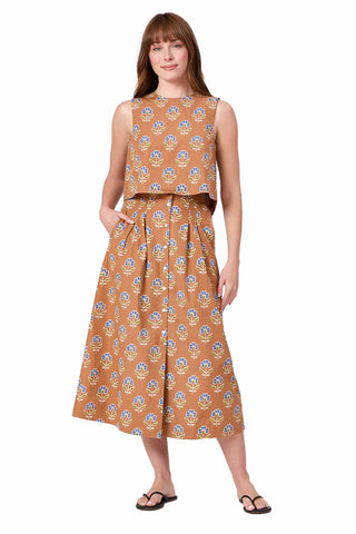 terracotta brown midi skirt with blue and green floral sprig pattern, featuring high waist and A-line silhouette with pockets. Livro Scout Skirt in Maple Sprigs