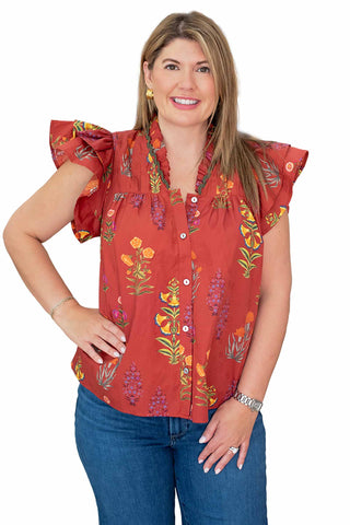 Entro Sophia top in red featuring vibrant wildflower print with flutter sleeves, button-front closure and relaxed fit