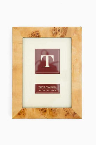 Wooden picture frame with a decorative 'T' logo and text on a white background