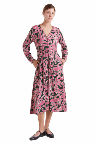The Juliet midi dress in pink and black abstract swirl print featuring V-neckline, tie waist, long sleeves and midi length for statement fashion