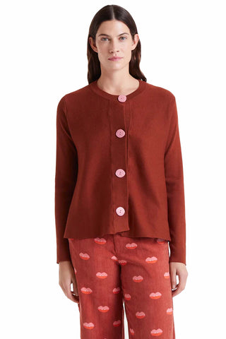 The Kayla cardigan in brown featuring round neck design, pink button details and soft knit construction for comfortable versatile layering