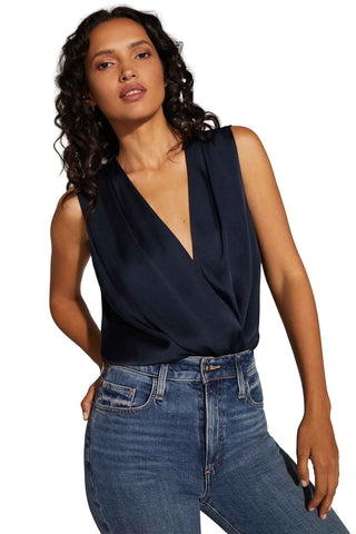 Favorite Daughter Sleeveless Date Blouse in navy featuring wrap-style silhouette with deep V-neckline and fluid drape for women's fashion