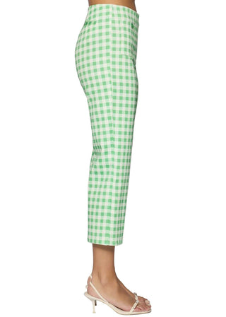 Green checkered pants worn by a person on a light gray background