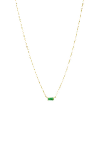 Delicate gold chain necklace with small rectangular emerald green stone pendant