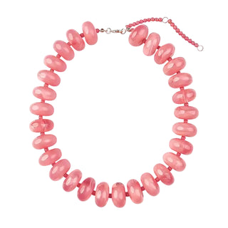 Necklace with pink beads on a white background