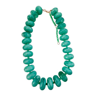 Turquoise beaded necklace on a white background