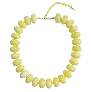 Necklace with yellow beads on a white background