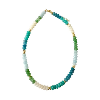 A beaded necklace featuring segments of light blue, green, teal, and cream beads separated by small gold spacer beads, displayed on a clean white background.