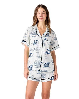 Woman wearing a pajama set with a white background
