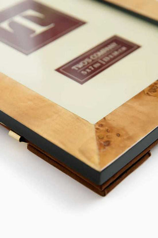 Close-up of a framed text with decorative elements on a white background